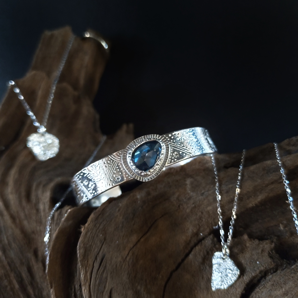 Two 925 handmade silver cuff and pendants by JK gems, featuring organic and textured designs